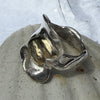 Designs by Flick 10ct gold heart ring on a broad wave of silver by Flick Pope, alternate view