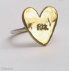 Flick Pope brass heart ring hand-stamped 'Flick', on a white background
