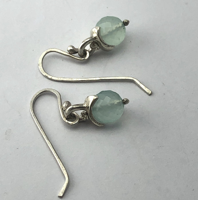 Flick Pope chalcedony and silver hook earrings, laid flat