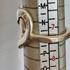Flick Pope Cross Your Heart silver ring, side view on a ring sizer