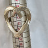 Flick Pope Cross Your Heart silver ring on a ring sizer