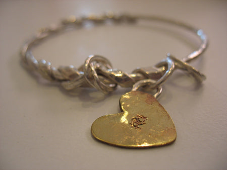 Flick Pope Doodad silver charm bangle with a brass heart