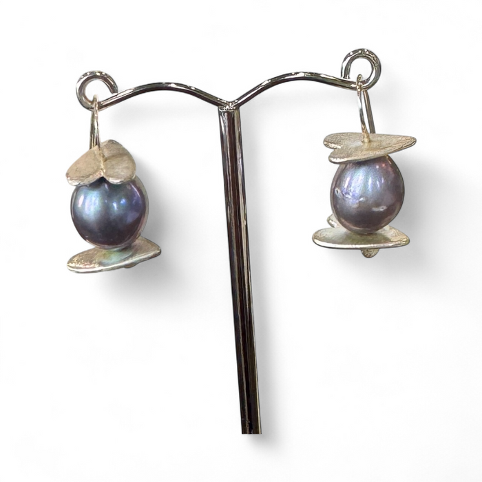 Flick Pope Oke Doke silver grey pearl earrings on a stand