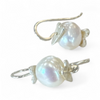 Flick Pope Oke Doke white pearl earrings, laid flat