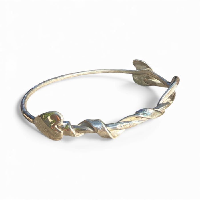 Close-up of the hearts on a Flick Pope Tangled Up Heart bangle