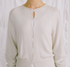Francie Anni lightweight cardigan in ivory, close-up of the shell button front