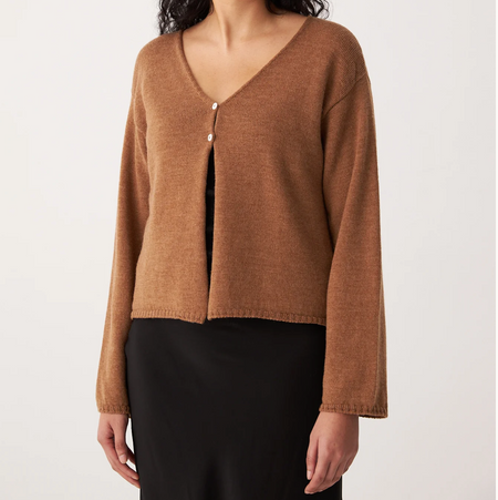 Francie Bella merino cardigan in brown sugar, a V-neck knit worn with a black skirt