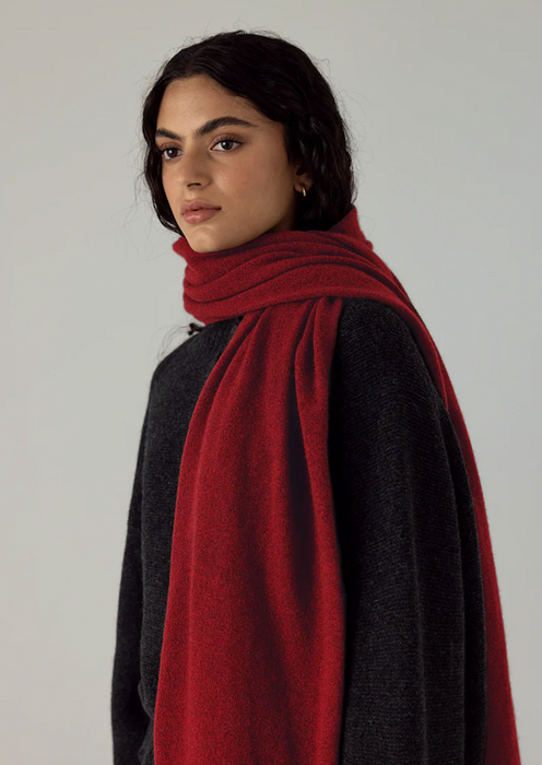 Francie Cloud possum merino scarf in poppy red, draped over the shoulders