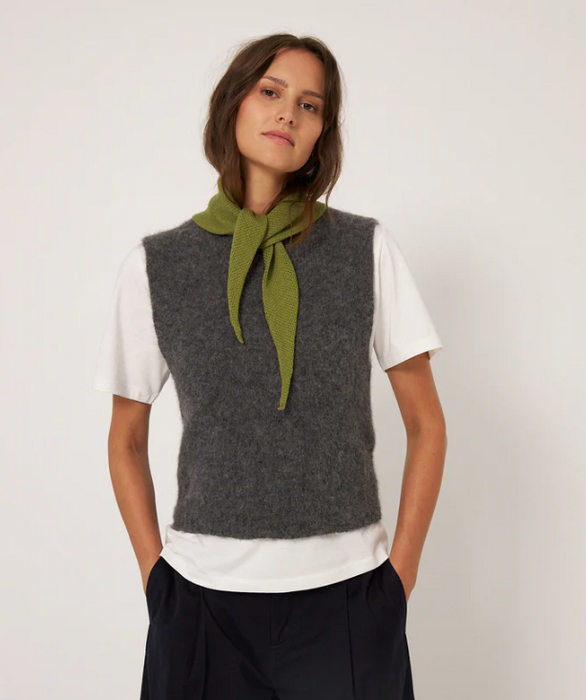 Francie Daisy merino scarf in green, tied at the neck with a grey knit vest