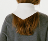 Francie Daisy merino scarf in ivory, back view tied over a grey jumper