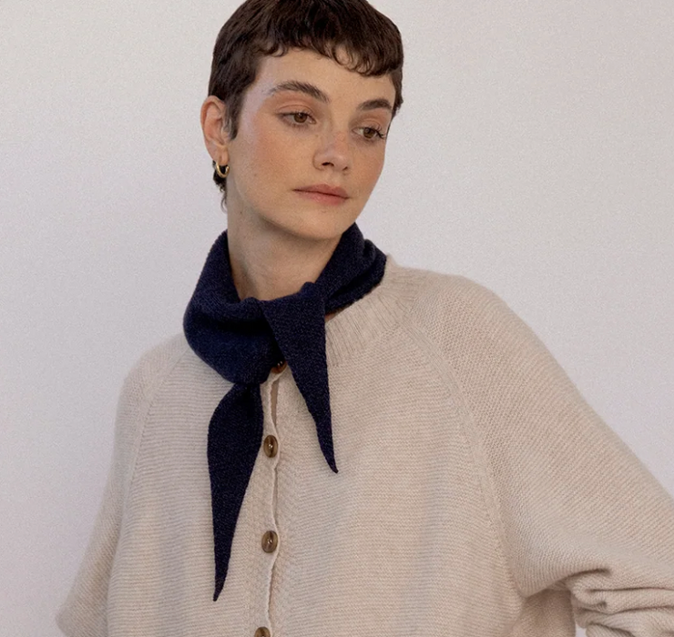 Francie Daisy merino scarf in midnight navy, tied at the neck with a cream cardigan