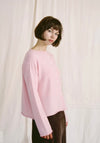 Francie Doll's reversible merino cardigan in barely pink, worn with a brown skirt