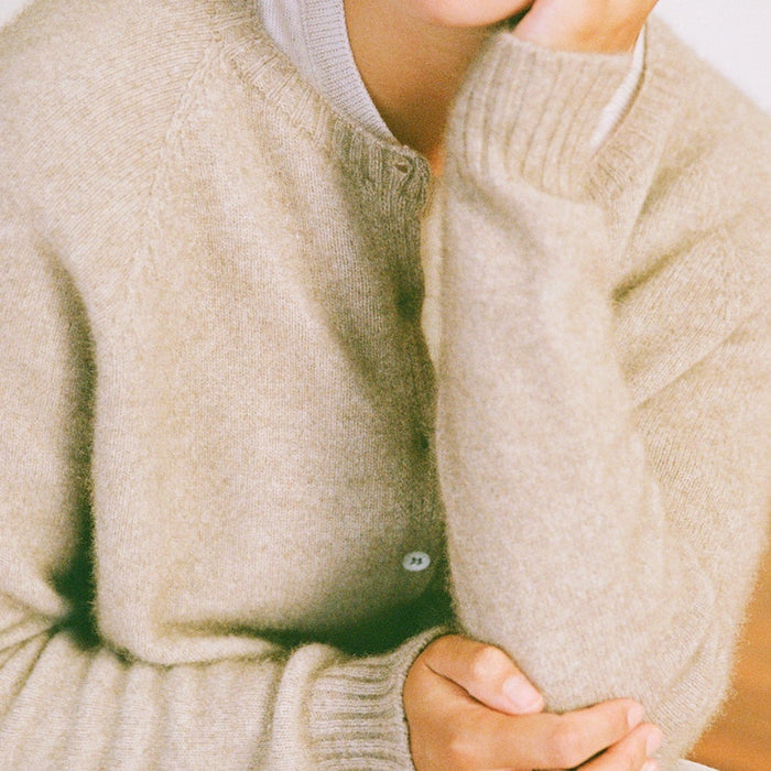 Close-up of the Francie Dusk cardigan in natural, showing the soft brushed knit and button placket