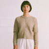 Francie Dusk cardigan in natural, a crew neck button-front knit cardigan worn with white trousers