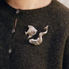Francie Dusk cardigan in truffle, a dark brown brushed knit with pearl buttons, styled with a fish brooch