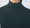 Francie Essence fine ribbed merino turtleneck, close-up of the rib knit in deep green