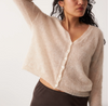 Francie Fleur mohair cardigan in pearl, a sheer cream V-neck knit, arm raised