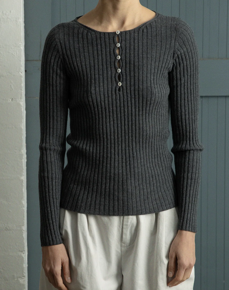Francie Form ribbed merino henley top in shadow grey, worn with cream trousers