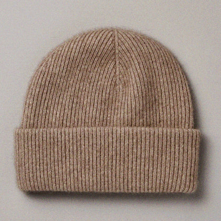 Francie Hinoki beanie in natural, a ribbed knit beanie with fold-up cuff, laid flat