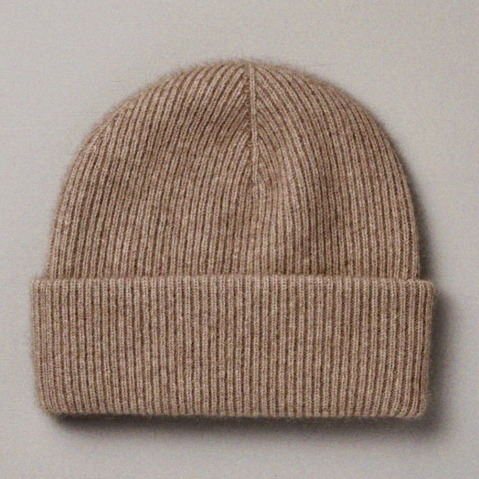 Francie Hinoki beanie in natural, a ribbed knit beanie with fold-up cuff, laid flat