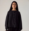 Francie Loft merino cardigan in charcoal, worn buttoned up, front view