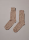 Natural coloured possum merino socks on plain background