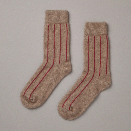 francie possum socks in natural with red stripe, ribbed knit laid flat, photography courtesy of Francie