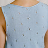 Back view of the Francie Posy cotton knit top in sky blue, showing the open-work pointelle knit