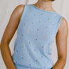 Francie Posy sleeveless cotton knit top in sky blue, close-up of the pointelle flower pattern and rolled neckline