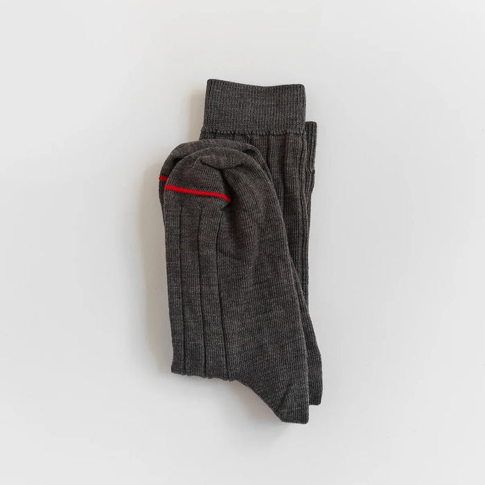 Francie tip toe crew socks in grey, folded flat showing ribbed knit and red contrast toe stripe