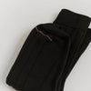 Francie tip toe knee-high socks in black, folded flat to show ribbed knit and contrast toe stripe