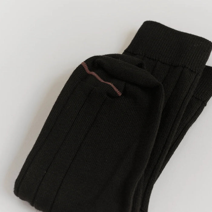 Francie tip toe knee-high socks in black, folded flat to show ribbed knit and contrast toe stripe