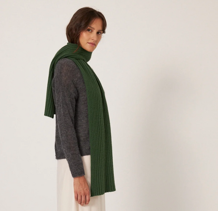 Francie Umbra merino possum scarf in green, long rib knit worn over a grey top