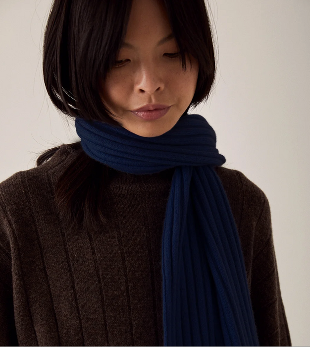 Francie Umbra merino possum scarf in navy, wrapped at the neck over a brown knit