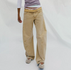 Free People Fable twisted seam bow leg jeans in oat latte, angled front view