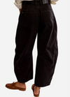 Free People Good Luck barrel jeans in black denim, back view with loafers