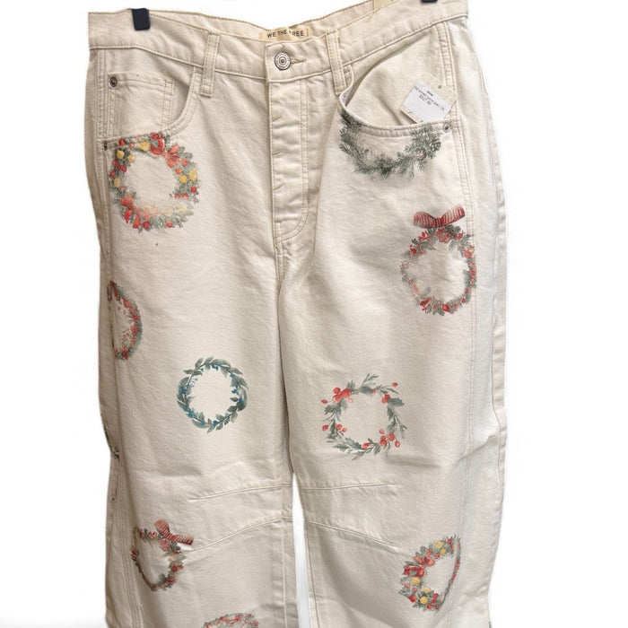 Free People cream barrel jeans with colourful embroidered wreath motifs, front