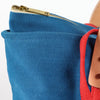 Immodest Cotton zippered canvas lunch bag, close-up of the brass top zip and red webbing handle