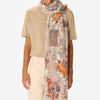 Inouitoosh Rome long cotton and silk scarf in powder pink, worn loose with a beige tee