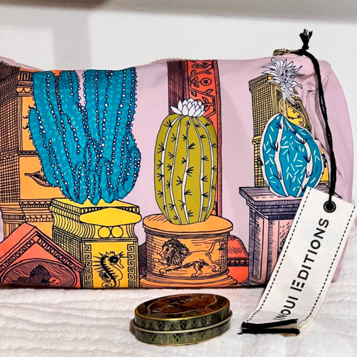 Inouitoosh Tequila grapefruit cactus print pouch with Inoui Editions tag and a vintage tin