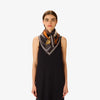 Model wearing the Inouitoosh Tequila lemon square scarf knotted at the neck