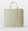 Woven tote bag on a white background