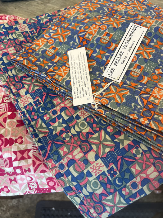 Les Belles Vagabondes Malmo cotton square scarves stacked in store, blue and pink colourways