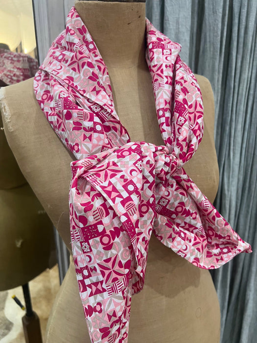 Les Belles Vagabondes Malmo cotton square scarf in fuchsia, tied on a mannequin