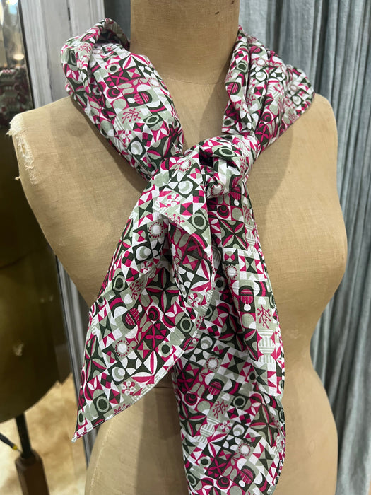 Les Belles Vagabondes Malmo cotton square scarf in rose pink and green, tied on a mannequin