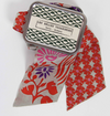 Les Belles Vagabondes Peony silk bandeau, red floral print, with its gift tin