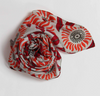 Les Belles Vagabondes square silk scarf, red and orange floral print, rolled