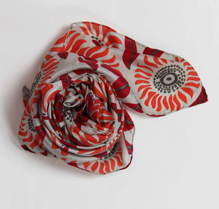Les Belles Vagabondes square silk scarf, red and orange floral print, rolled