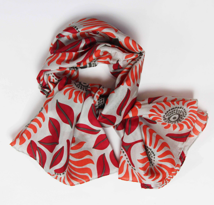 Les Belles Vagabondes square silk scarf, red and orange floral print, loosely twisted