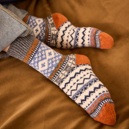 Close-up of Lisa B Fairisle wool cashmere crew socks in pumpkin showing blue and orange Fair Isle pattern